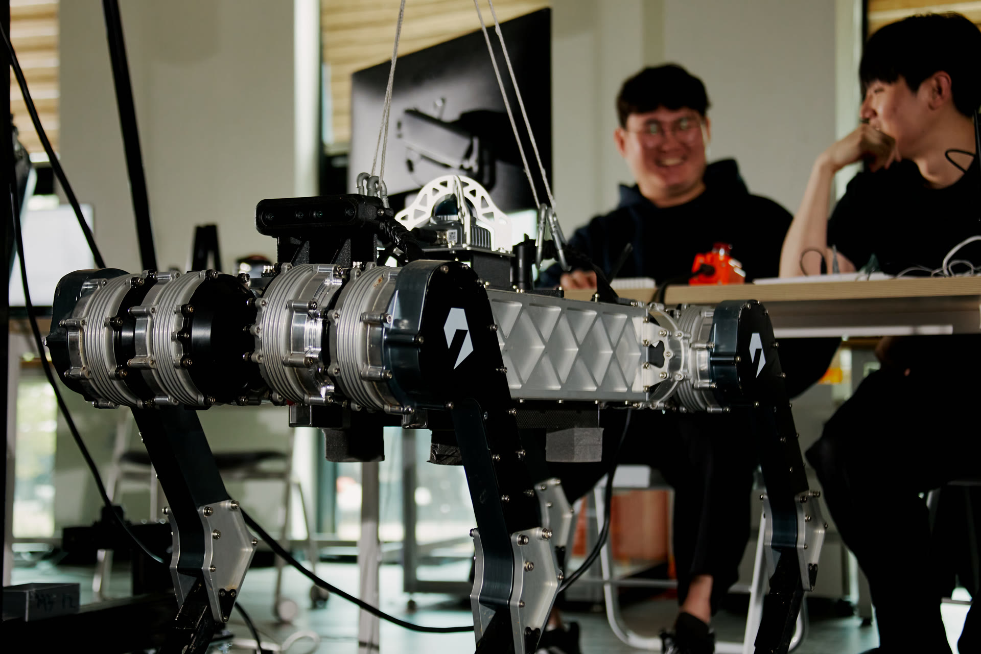 Raion Robotics engineers with quadruped robot